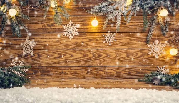 Old wooden planks with christmas decoration. Brown background with snow and snowflakes