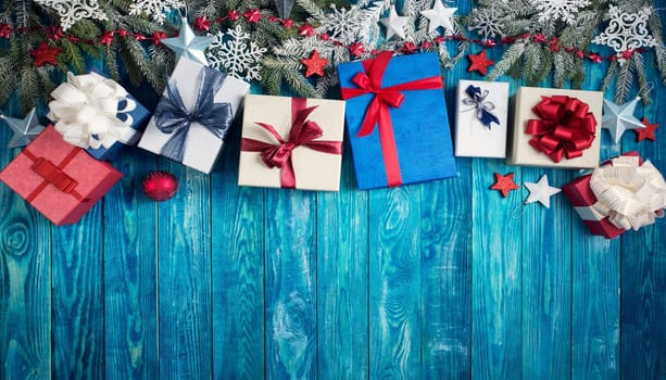 Christmas stars on wooden background with fir tree branches. Winter background