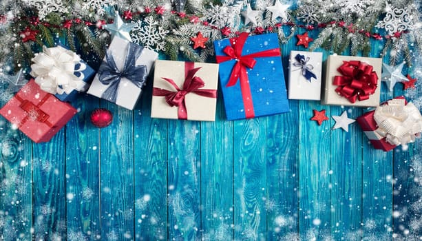 Christmas stars on wooden background with fir tree branches. Winter background