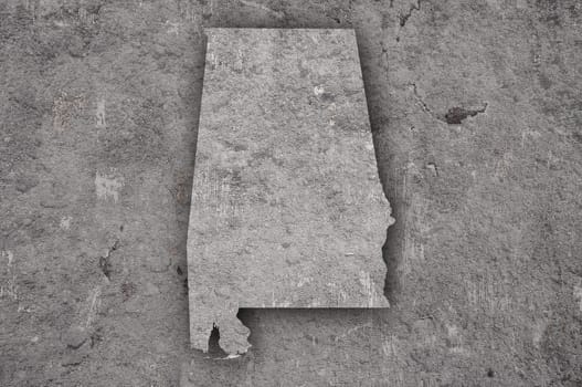 Map of Alabama on weathered concrete