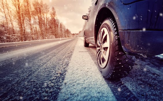 car on winter road in the morning