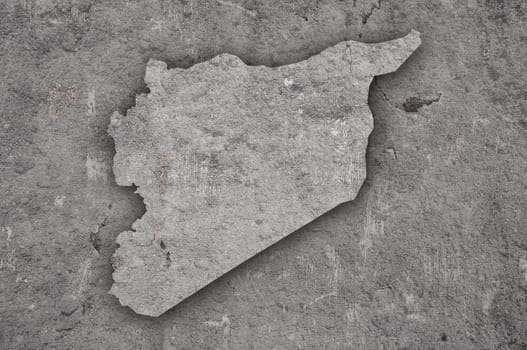 Map of Syria on weathered concrete