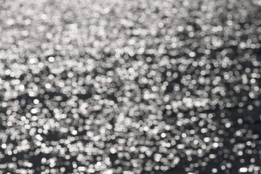 2 - Full frame plain abstract textured water bokeh round circles background. Random pattern effect of white circles on a dark grey background