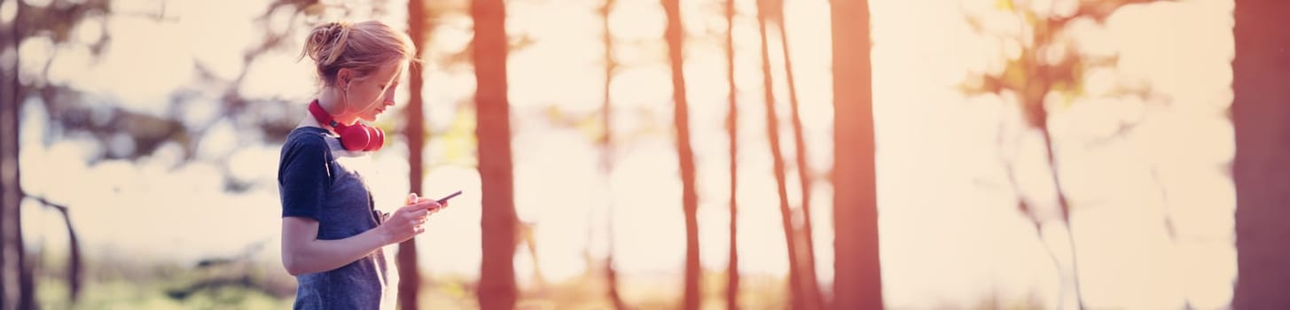 Young woman running in the park. Active person outdoors at the dusk in summer