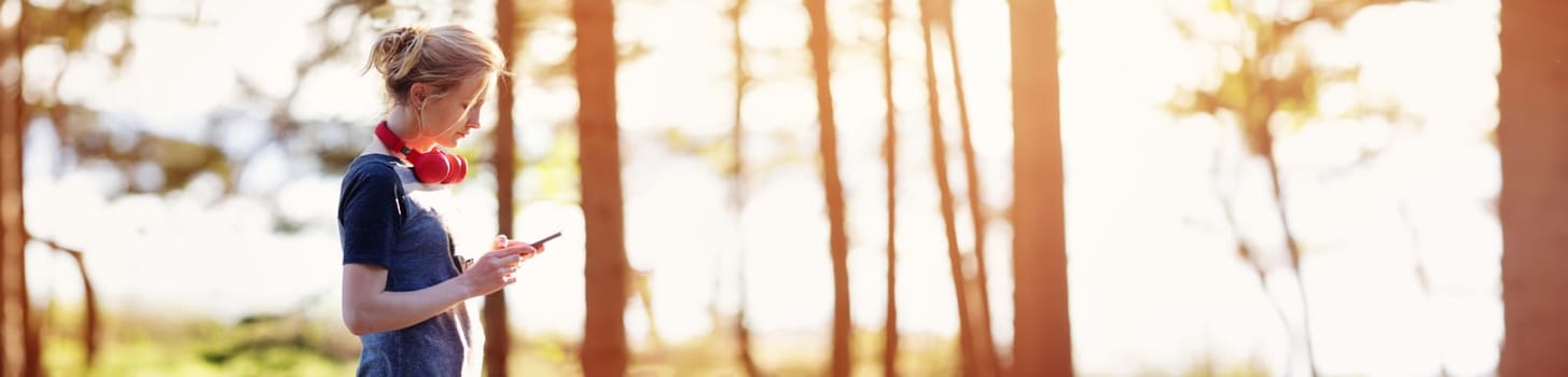 Young woman running in the park. Active person outdoors at the dusk in summer