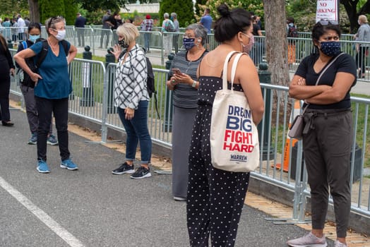 Washington, DC / USA - 9/24/2020: Mourners in long lines in front of Capital building to pay last respects to Justice Ruth Bader Ginsburg