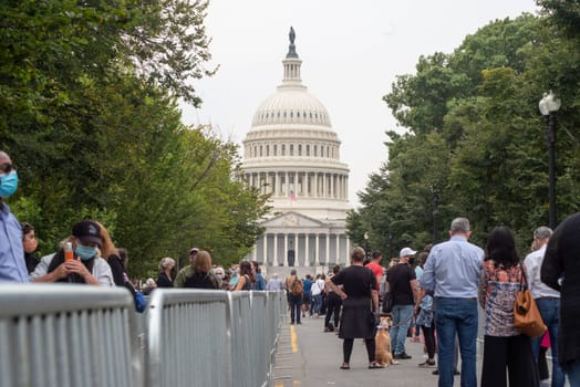 Washington, DC / USA - 9/24/2020: Mourners in long lines in front of Capital building to pay last respects to Justice Ruth Bader Ginsburg