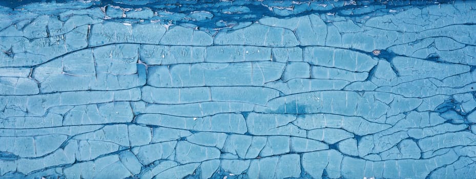 Old blue wooden planks. Rustic background with painted boards. Faded wall texture