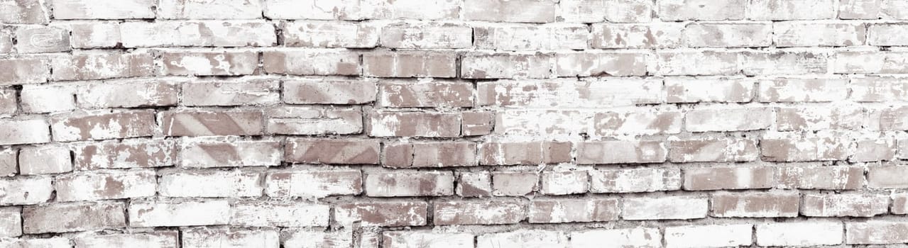 Rustic red brick background with white paint. Dirty wall pattern of an old building. Brickwall texture