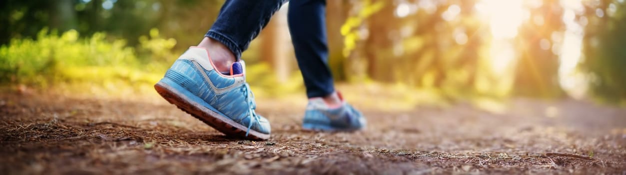 Young woman hiking and going camping in nature. Person with walking and running in the forest