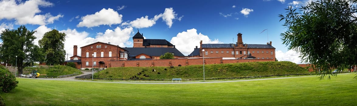Panoramic view on the old fortress and former prison for women in Hameen linna,Finland. Ancient castle with blue sky and white fluffy clouds.