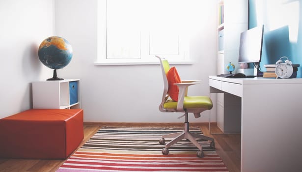Colourful children rooom with white walls and furniture. Desk at home interior with a window