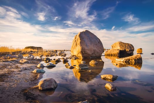 Rocks at seaside in Kasmu village on beautiful evening at sunset