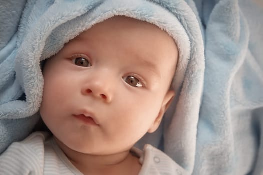 3 month old baby sleeping on blue blanket with stars
