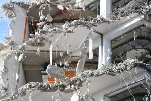 Close-up of a high-rise building that is currently being demolished.