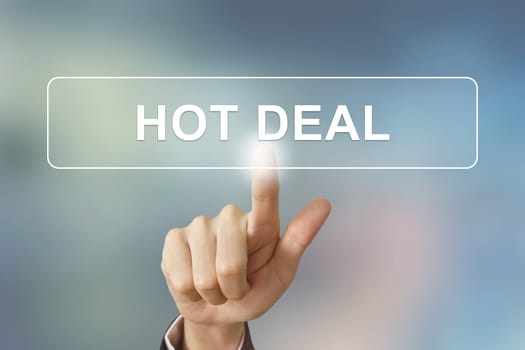 business hand pushing hot deal button on blurred background