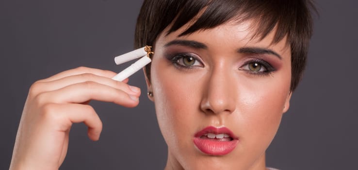 A woman so young has already had enough of smoking