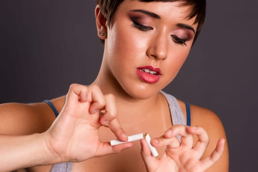 A woman so young has already had enough of smoking