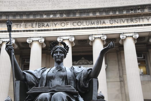 The bronze statue Alma Mater in front of the library of Columbia University in the borough of Morningside Hights - Manhattan. New York.