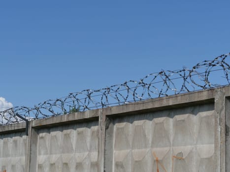 high fence with barbed wire restricted area concept