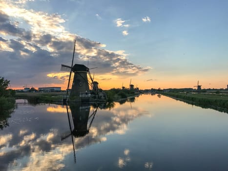 Beautiful dutch windmill landscape at the famous Kinderdijk canals, UNESCO world heritage site