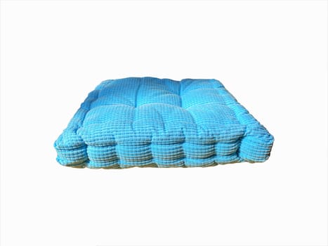 Blue pillow isolated on white background. Selective focus