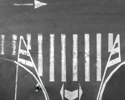 Pedestrian crossing on which people go. View from above. Zebra.