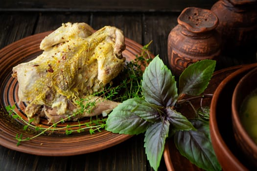 roast wild partridge plated meal on rustic table and brown plate
