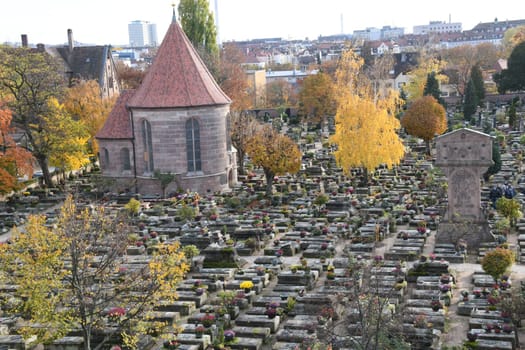 The historic St. John's Cemetery in Nuremberg in autumn with the wooden cutter's chapel built in 1513-1515 and a Stations of the Cross by Adam-Kraft from 1506-1508.