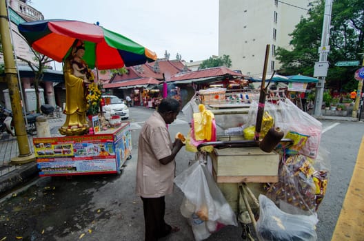Georgetown, Penang/Malaysia - Jul 02 2016: Benggali bread seller at the street of Jalan Masjid Kapitan Keling.