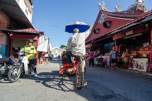 Georgetown, Penang/Malaysia - Jul 30 2016: Rickshaw ride near the Goddess of Mercy temple.