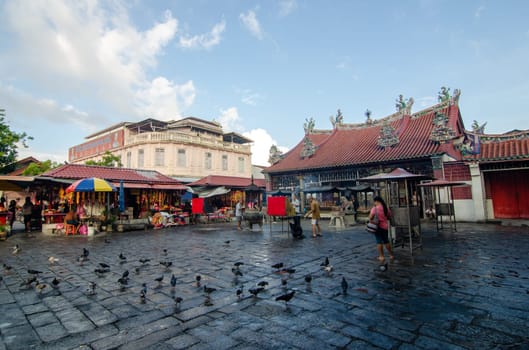 Georgetown, Penang/Malaysia - Jul 31 2016: Pigeons stay in front of the Goddess of Mercy temple.