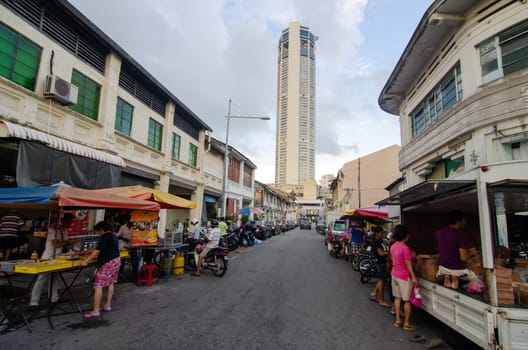 Georgetown, Penang/Malaysia - Jul 31 2016: Penang street stall and KOMTAR building at background.