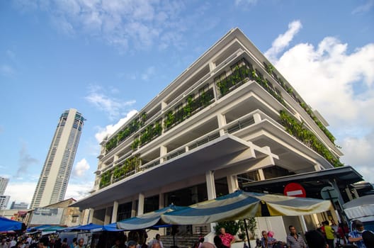 Georgetown, Penang/Malaysia - Jul 31 2016: Chowrasta market with green plant and KOMTAR building at background.