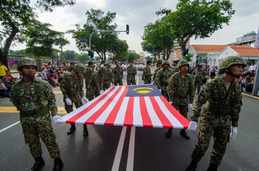 Georgetown, Penang/Malaysia - Aug 31 2016: Soldiers carry Malaysia flag during independance day.