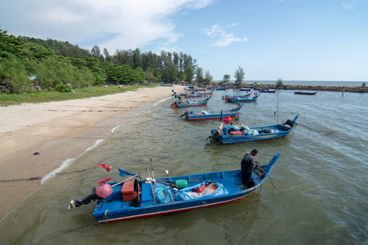 George Town, Penang/Malaysia - Mar 23 2017: Fisherman tie the knot of fishing boat.