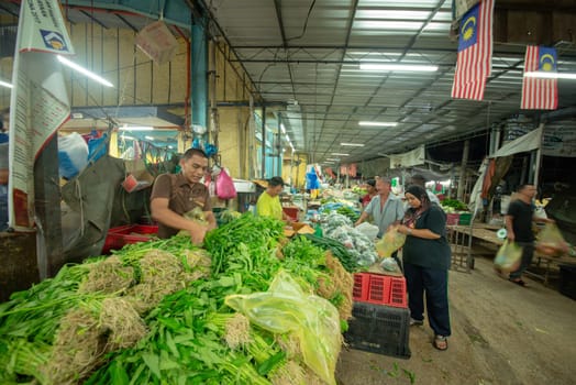 Bukit Mertajam, Penang/Malaysia - Mar 11 2017: People go morning market buy vegetables.