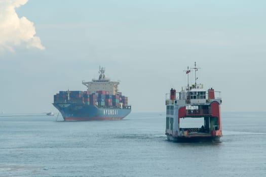 George Town, Penang/Malaysia - Jun 27 2017: Aerial view ferry move at sea. back is container ship