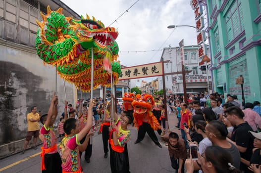 George Town, Penang/Malaysia - Jul 07 2017: Dragon dance and lion dance perform at street.