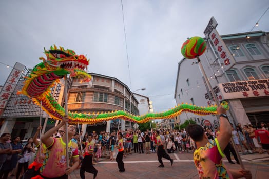 George Town, Penang/Malaysia - Jul 07 2017: Dragon dance chase the pearl at street.