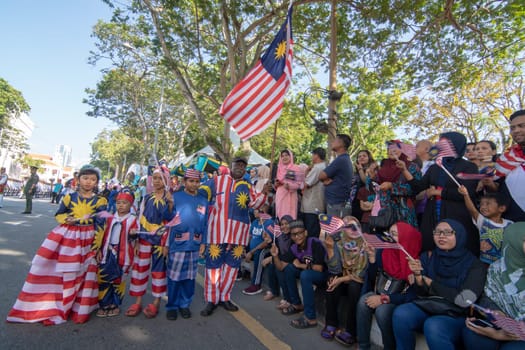 George Town, Penang/Malaysia - Aug 31 2017: Malaysian with jalur gemilang costume stand together.