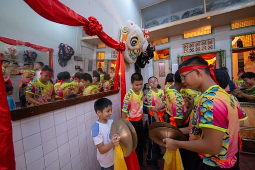 George Town, Penang/Malaysia - Jul 07 2017: Kids learn play drum for lion dance performance.