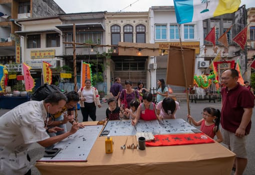 George Town, Penang/Malaysia - Jul 07 2017: Chinese calligraphy perform at street