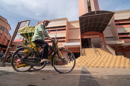 Kota Bahru, Kelantan/Malaysia - Jul 15 2017: A man cycle to pasar Siti Khdijah.