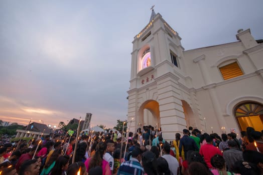 Bukit Mertajam, Penang/Malaysia - Jul 29 2017: Devotees attend with white candle during last day of St Anne feast.