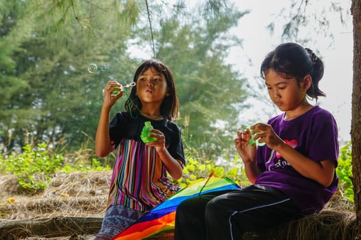 Kota Bahru, Kelantan/Malaysia - Jul 15 2017: Two Malay kids play bubble.