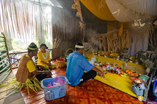 Carey Island, Selangor/Malaysia - Mar 17 2018: Malaysia aborigine Mah Meri with mask at oil palm estate, Malaysia indigenous Mah Meri perform traditional cultural at wooden house.
