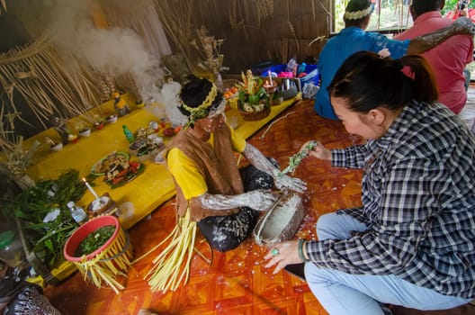Carey Island, Selangor/Malaysia - Mar 17 2018: Malaysia aborigine Mah Meri with mask at oil palm estate,Malaysia aborigine Mah Meri cultural ritual in wooden house.