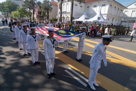 George Town, Penang/Malaysia - Aug 31 2017: Marching while carry Malaysia flag during National day.