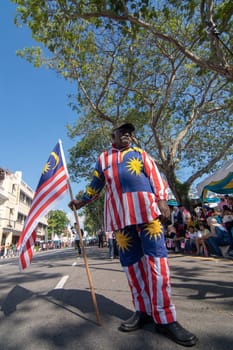 George Town, Penang/Malaysia - Aug 31 2017: An Indian man with Malaysia flag and costume.